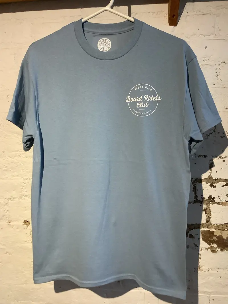 West Pier Stone Blue T-Shirt Showcasing Circular Board Riders Club Logo